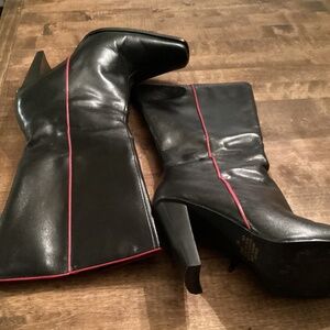 Women’s black leather boots with red stripe on the side